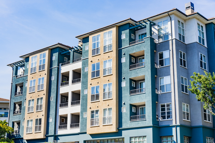 Exterior of a professionally managed apartment community of the kind a DST may hold