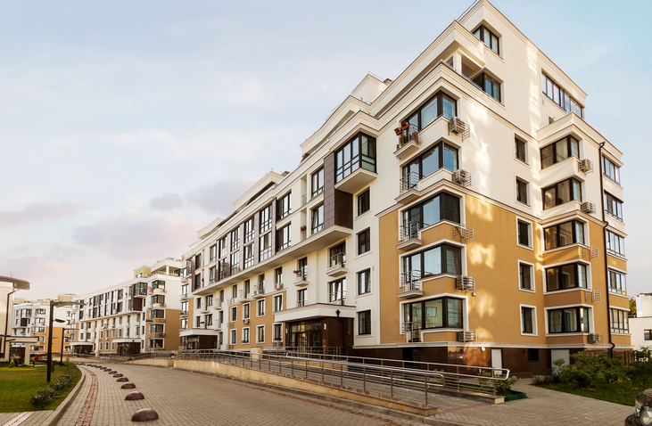 Exterior of a professionally managed apartment community, the kind of property a DST may hold