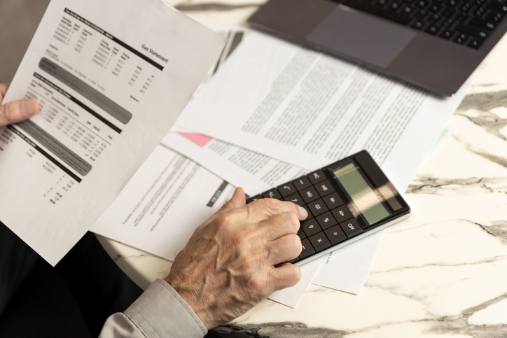 Mortgage statement and financial records on a desk